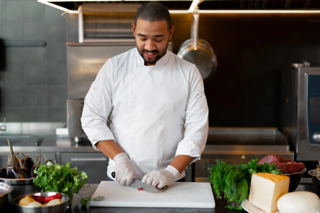 Personal chef in a modern kitchen stirring ingredients with sunlight streaming in