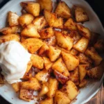Delicious air fryer apples served in a bowl, showcasing their crispy texture.