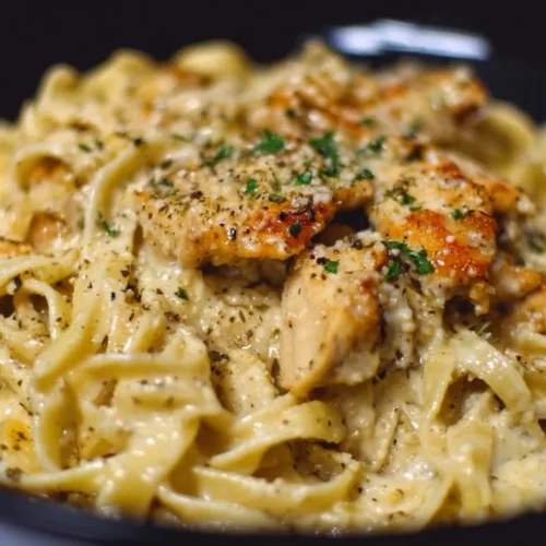 Delicious Chicken Garlic Parmesan Pasta topped with herbs and cheese.