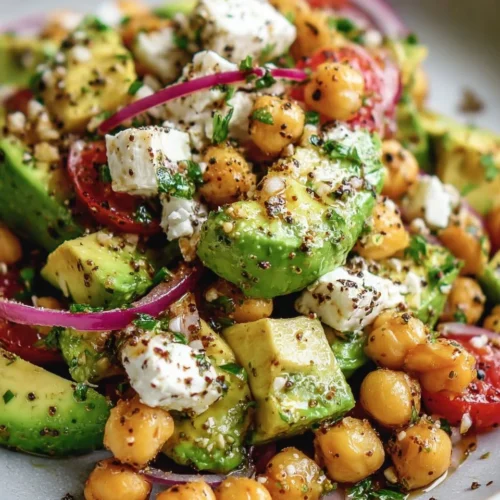 Chickpea Feta Avocado Salad with fresh ingredients in a bowl
