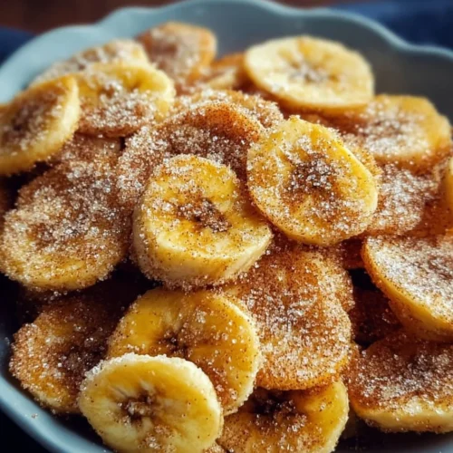 Cinnamon-sugar air fryer banana chips served in a bowl