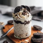 Delicious cookies and cream overnight oats topped with chocolate cookies.