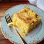 Delicious corn casserole served in a baking dish with golden topping