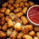 Crispy air fryer gnocchi served with herbs and dipping sauce