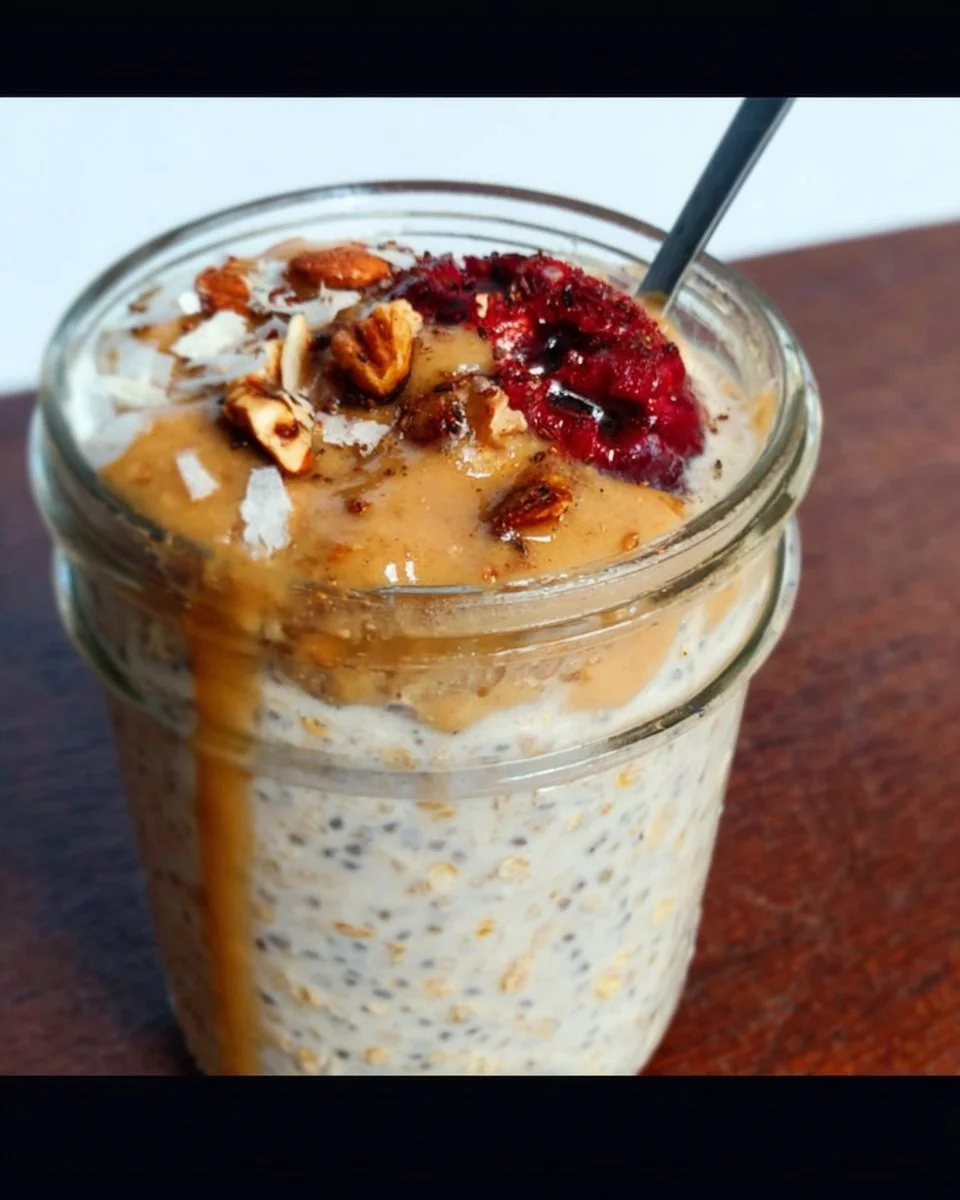 High-protein overnight oats in a bowl topped with fruits and nuts