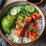 Delicious Honey Sriracha Salmon Bowls topped with fresh vegetables.