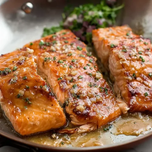 A perfectly baked salmon fillet with a rich maple dijon glaze