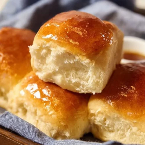 Freshly baked Texas Roadhouse Rolls served with cinnamon butter