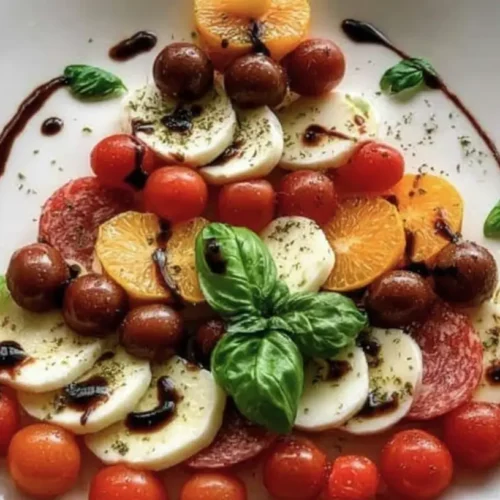 A table laden with various Christmas food dishes for a festive gathering.