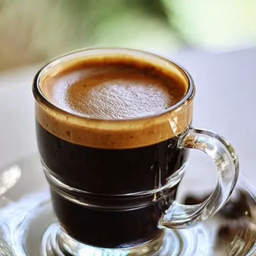 Various espresso drinks displayed on a counter