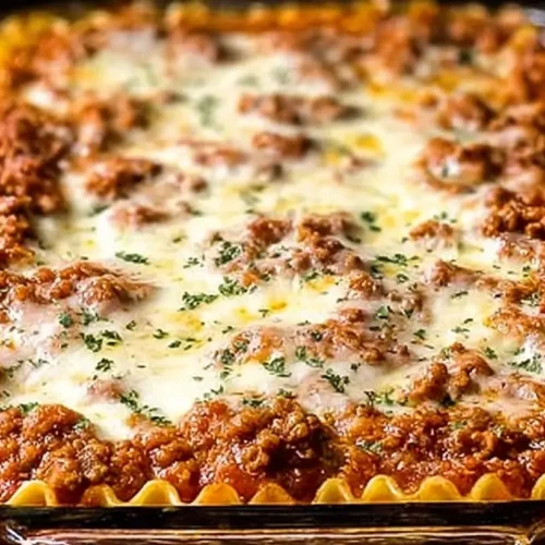A baked million dollar Italian lasagna, richly layered and golden brown.