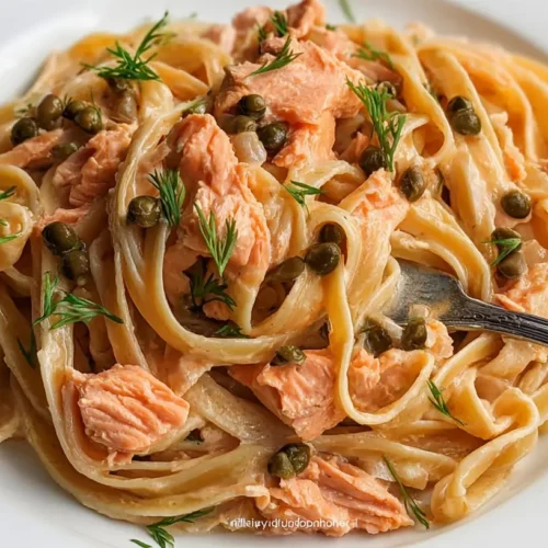 A serving of savory salmon pasta in a bowl