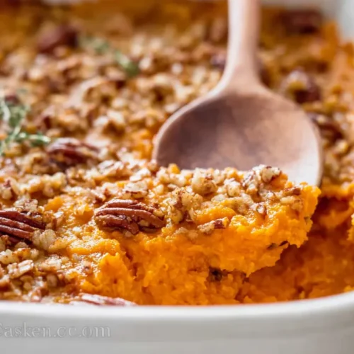 A freshly baked sweet potato casserole topped with toasted marshmallows.