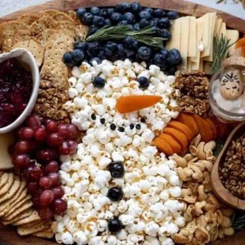 An assortment of festive Xmas food items on a decorated table.