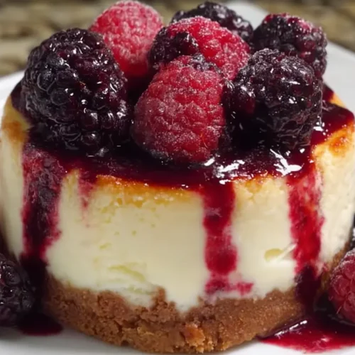 A stunning Blackberry Raspberry Cheesecake Delight featuring intertwined dark and red swirls.