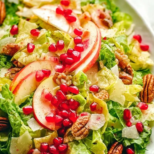 A visual of a fresh pomegranate salad, vibrant with color and texture.
