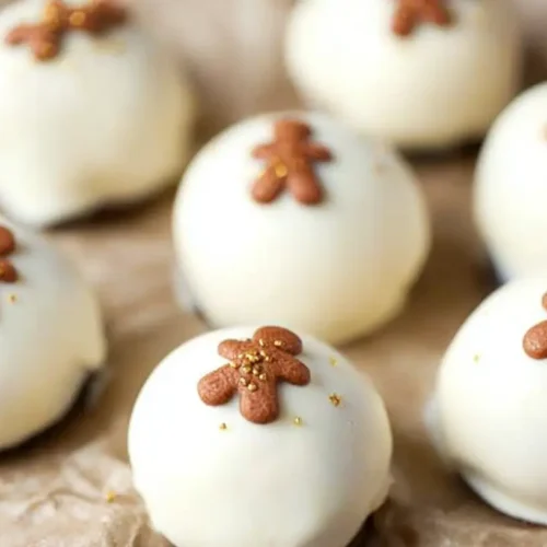 Delicious gingerbread Oreo truffles coated in white chocolate and sprinkles