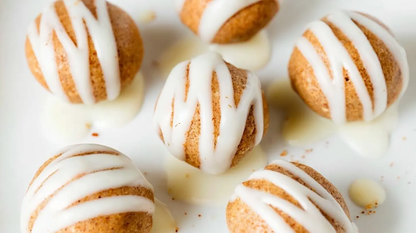 A close-up of healthy cinnamon roll protein bites on a tray
