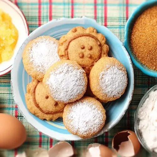 A plate of delicious secret ingredient sugar cookies, perfectly baked and decorated.