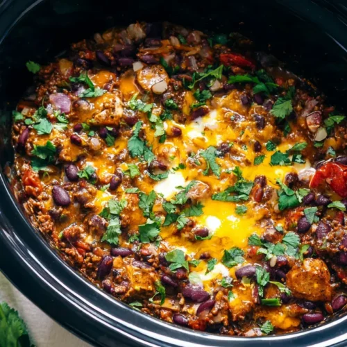 A bubbling slow cooker cowboy casserole, rich with meat and vegetables