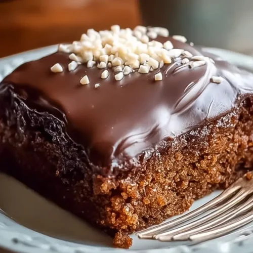 A full sheet pan of classic Texas Sheet Cake, rich chocolate with creamy icing.