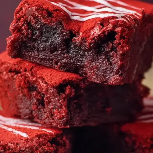 Close-up of decadent fudgy red velvet brownies with white chocolate swirls