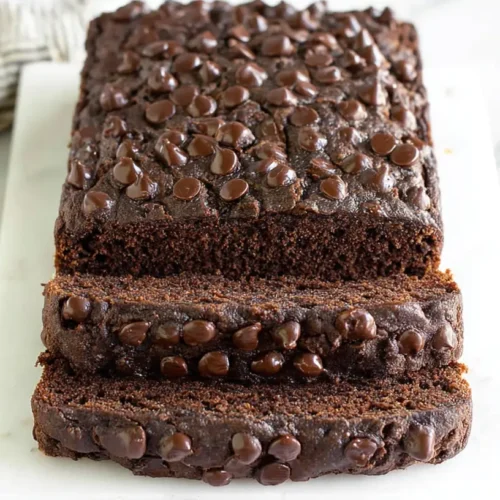 A slice of guilt-free chocolate banana bread delight, showing its moist texture.