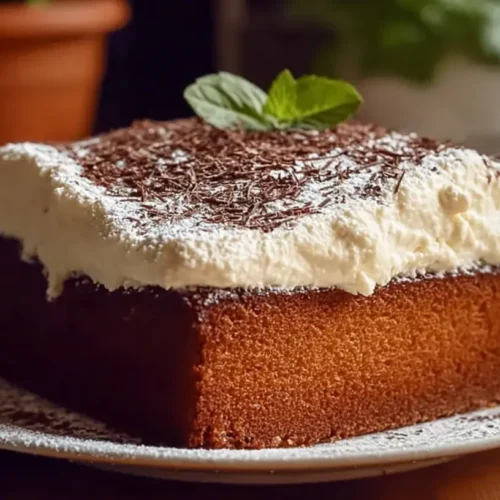 A delectable slice of Traditional Italian Love Cake on a white plate.