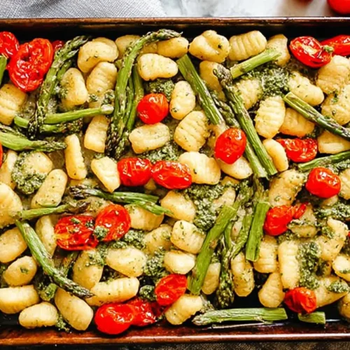 Sheet pan pesto gnocchi with crispy edges and spring vegetables