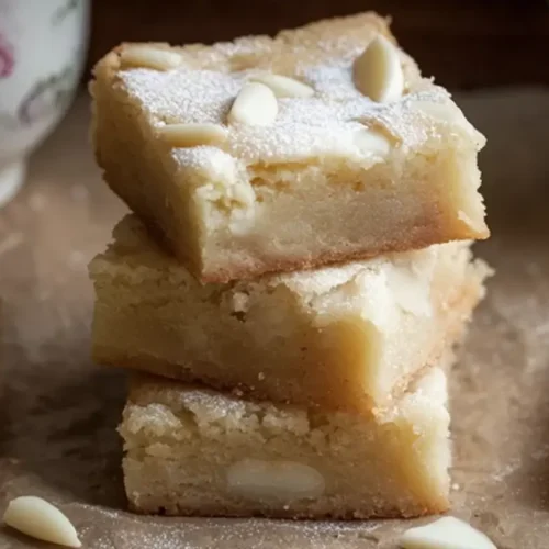 Close-up of white chocolate brownies with visible chunks of white chocolate