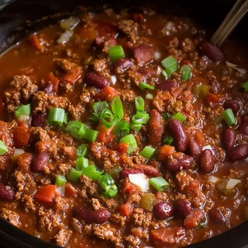 A pot of simmering crockpot chili, rich and smoky.