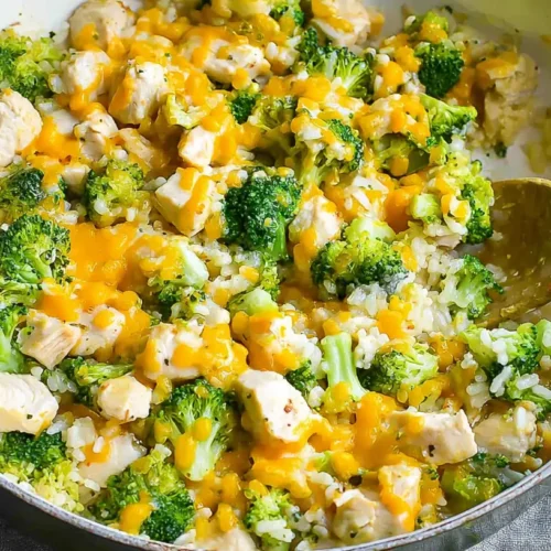 A wholesome dump-and-bake creamy chicken broccoli rice casserole dish ready to eat