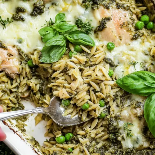 A Dump-and-Bake Pesto Chicken Orzo dish, fresh from the oven