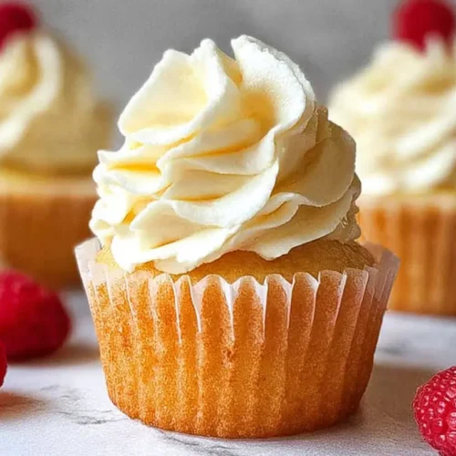 Deliciously frosted easy vanilla cupcakes arranged neatly on a serving tray