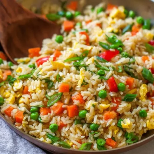 A vibrant bowl of fast veggie fried rice with colorful vegetables and fluffy rice