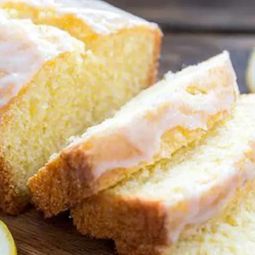 A delicious lemon loaf cake, freshly baked and ready to slice.