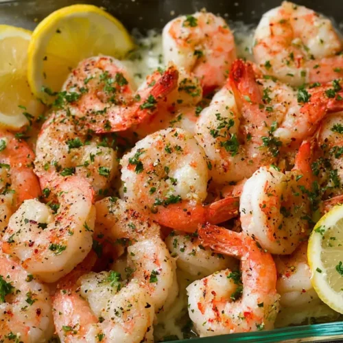 A delicious baked shrimp dinner served in a skillet.