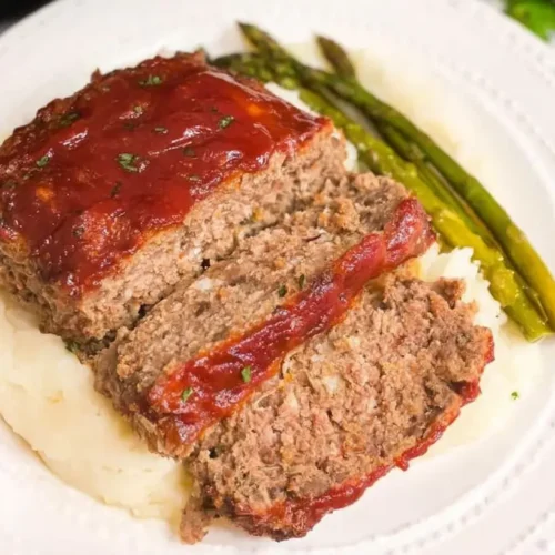 A baking dish filled with an easy meatloaf prepared with few ingredients.