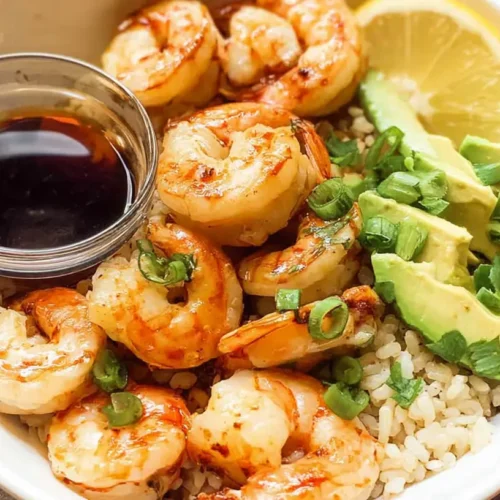 A vibrant easy shrimp and rice bowl with fresh vegetables