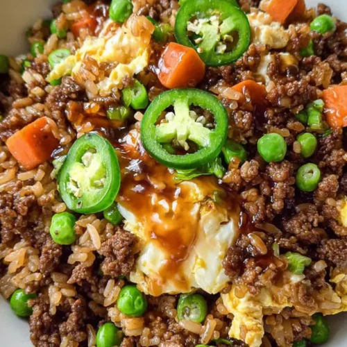 A serving of delicious ground beef fried rice in a bowl.
