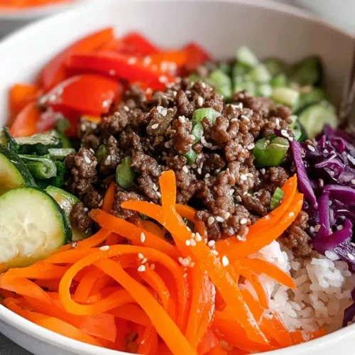Ground beef veggie bowls with colorful vegetables and rice