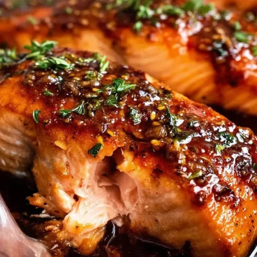 A perfectly cooked honey garlic salmon fillet, glistening and golden brown.