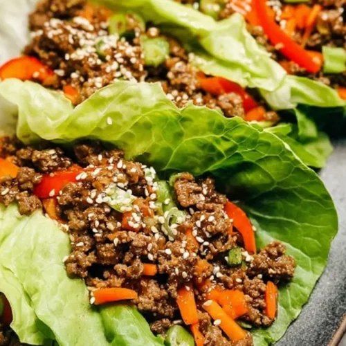 Lean ground beef lettuce wraps prepared on a clean white plate