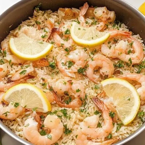 A one-pan garlic shrimp dinner with roasted vegetables, ready to serve.