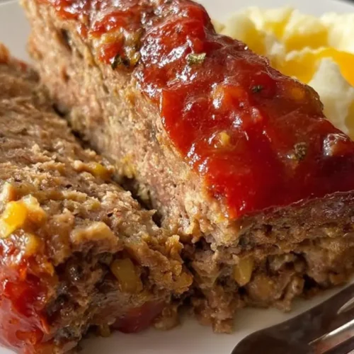 A baked quick and simple meatloaf recipe, perfectly browned and sliced.