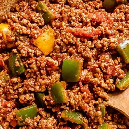 A prepared lean ground turkey dinner with vegetables on a plate.