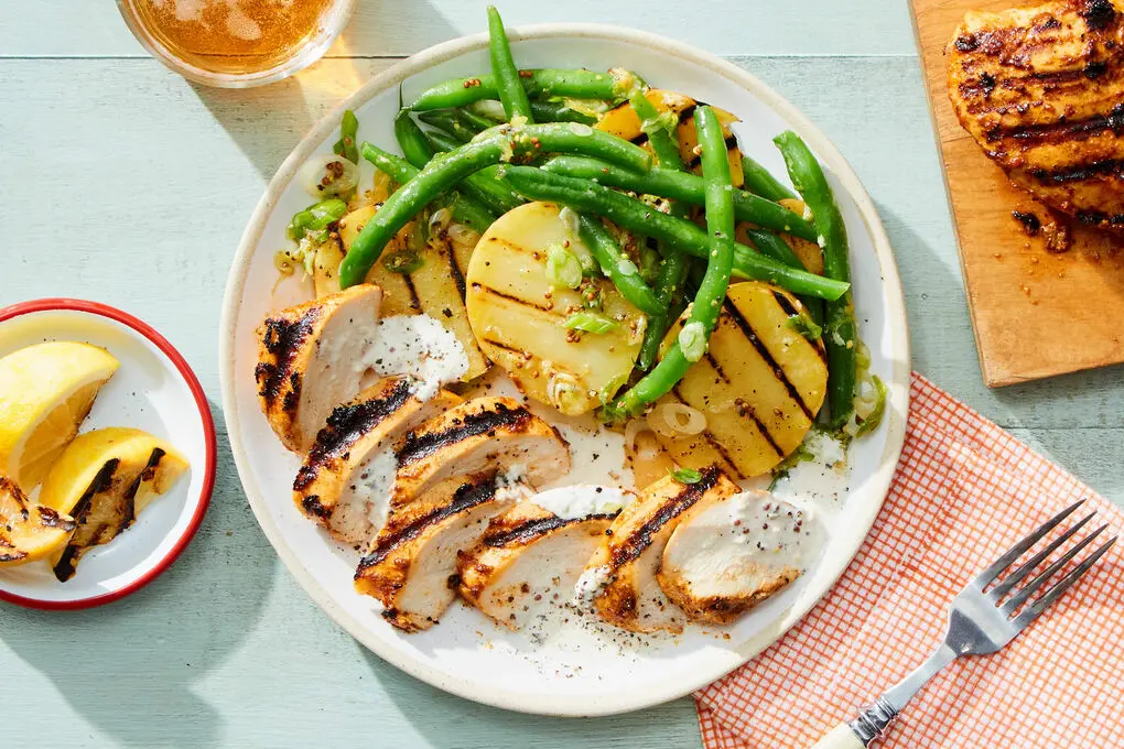Grilled chicken coated in Alabama white chicken sauce