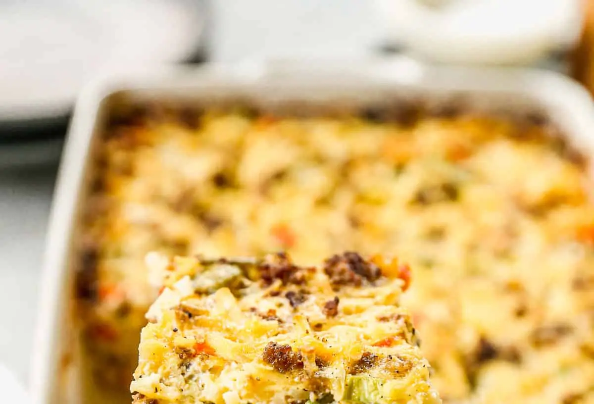 A golden brown breakfast casserole featuring hash browns and melted cheese