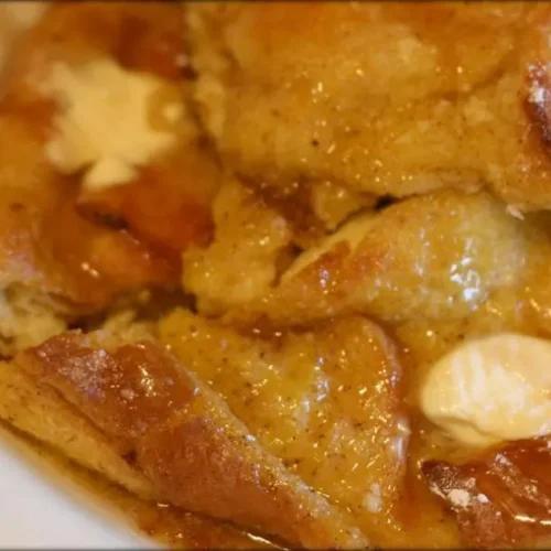 A freshly baked family-style breakfast casserole bake with eggs, cheese, and sausage.