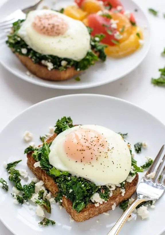A vibrant spread of feel-good healthy breakfast recipes on a wooden table.